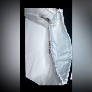 CHANEL White dust bag.